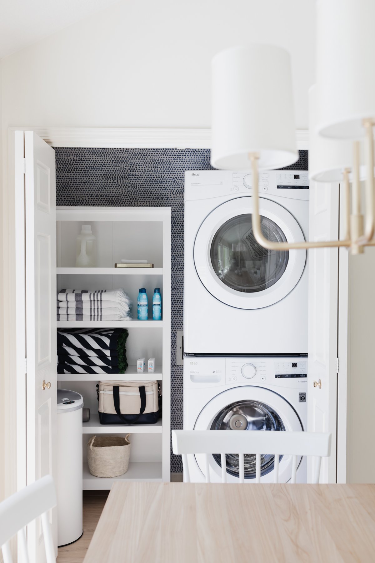 A laundry closet with a washer and dryer.