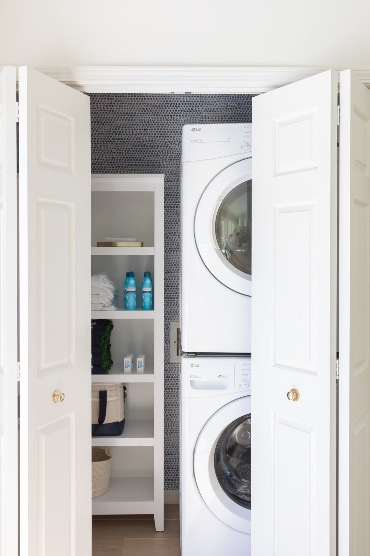 A laundry closet with a washer and dryer.