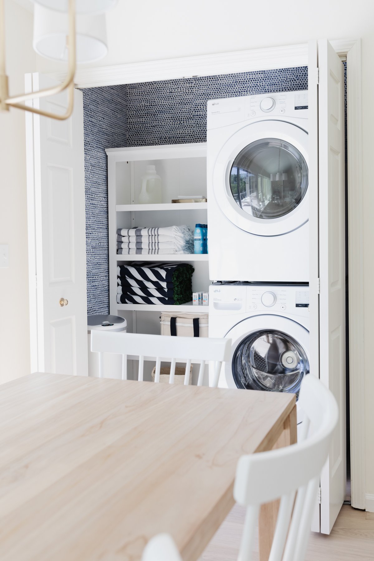 A laundry closet with a washer and dryer.