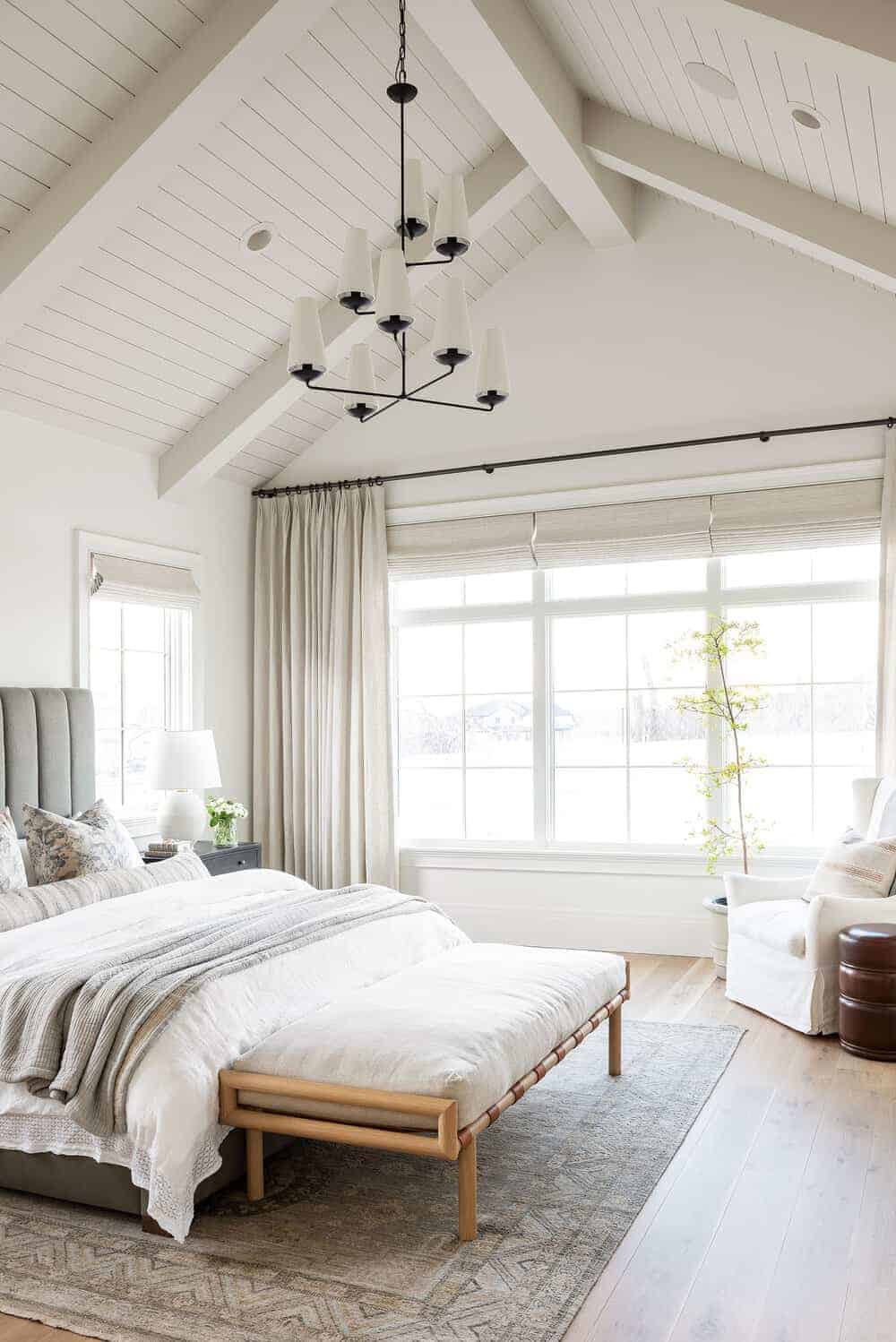 bedroom with vaulted ceilings painted in benjamin moore swiss coffee