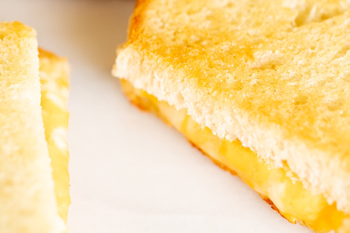 An oven baked grilled cheese on a marble countertop.