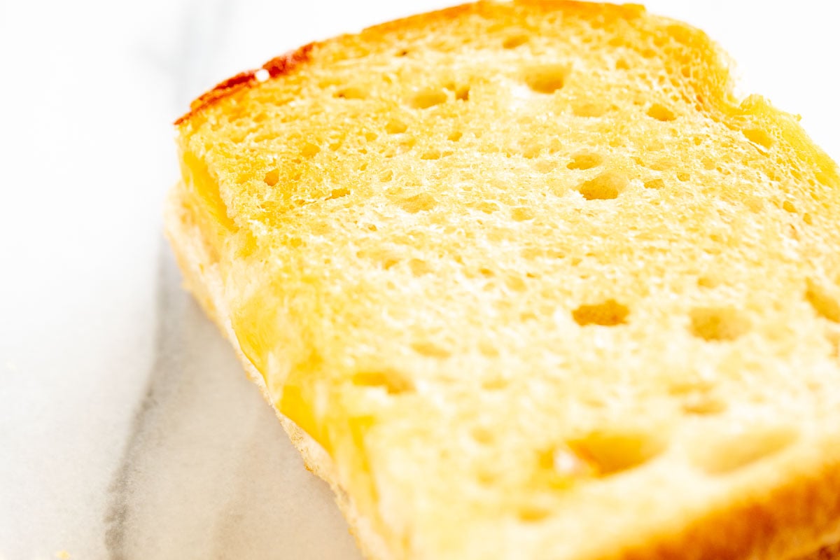 An oven baked grilled cheese on a marble countertop.