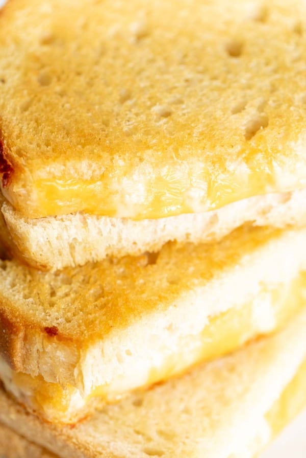 An oven baked grilled cheese on a marble countertop.