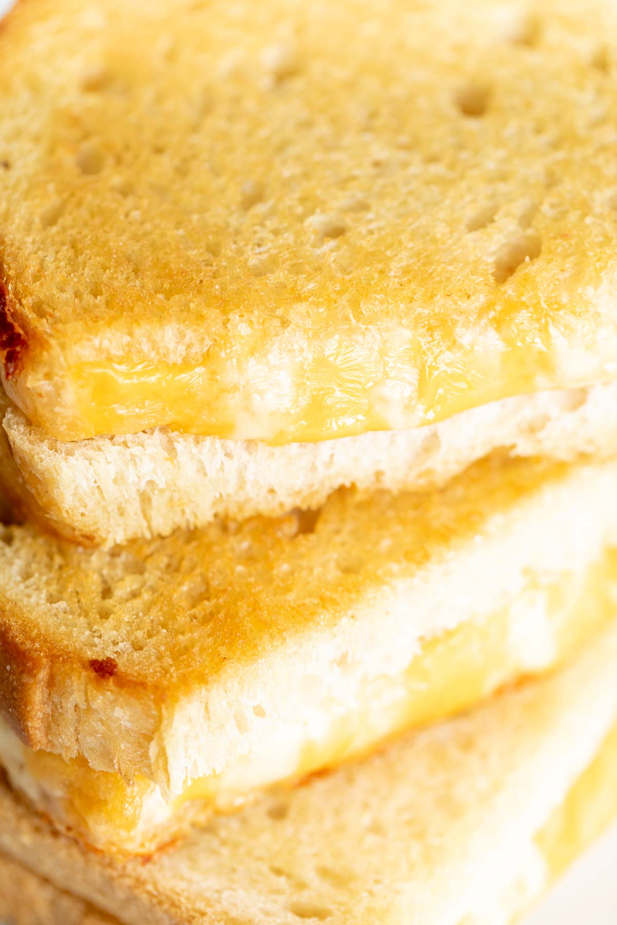 An oven baked grilled cheese on a marble countertop.