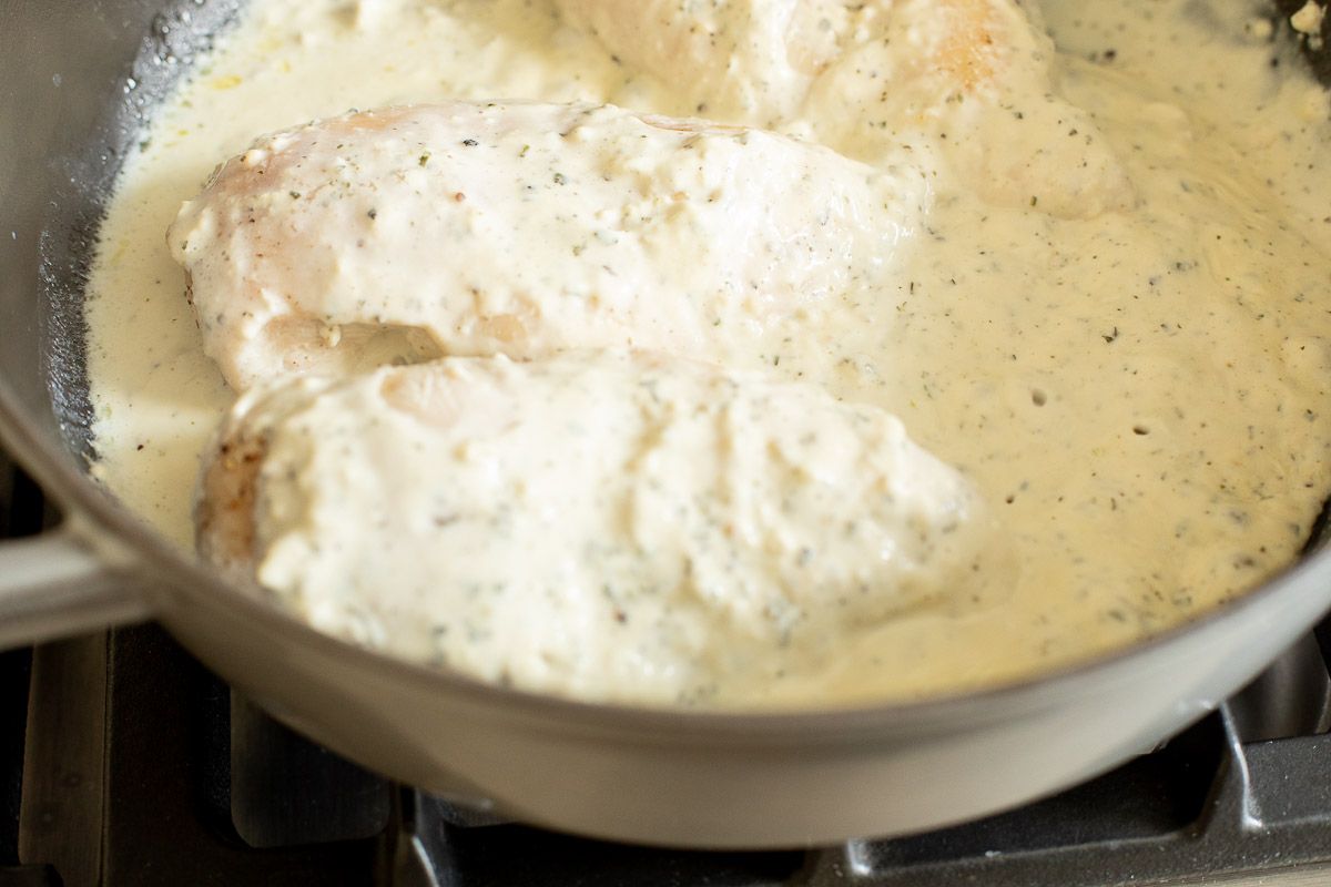 Boursin chicken in a cast iron skillet.