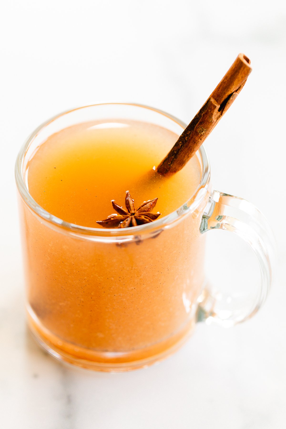 a clear glass mug of homemade pear cider
