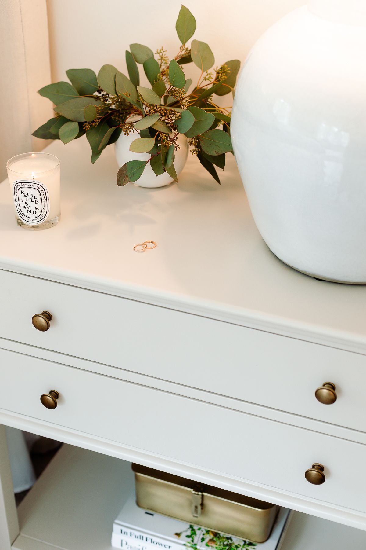 close up of a nightstand painted in pale oak benjamin moore.