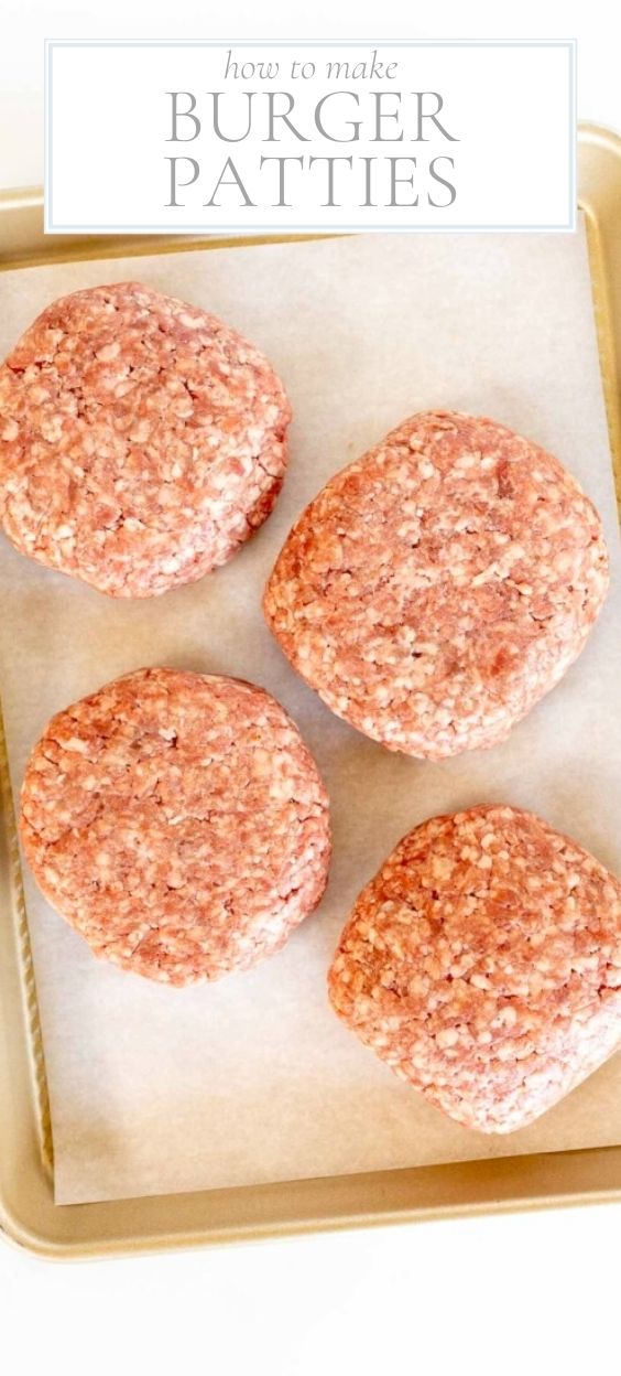 A gold baking sheet with four burger patties on parchment paper.