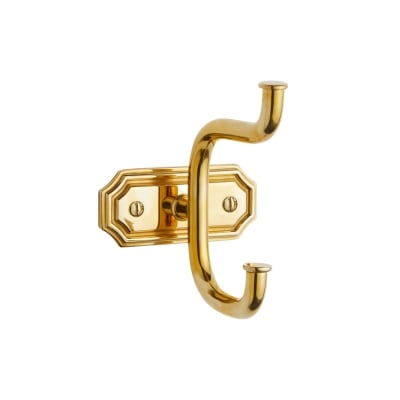 A double brass hook against a white background.