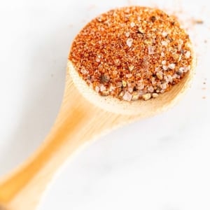 small wooden spoon full of the best burger seasoning