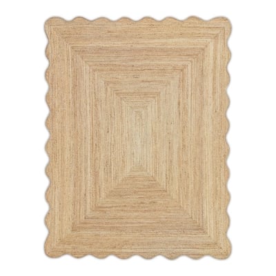 A wooden placemat with a scalloped edge perfect for adding a touch of rustic charm to your tablescape.