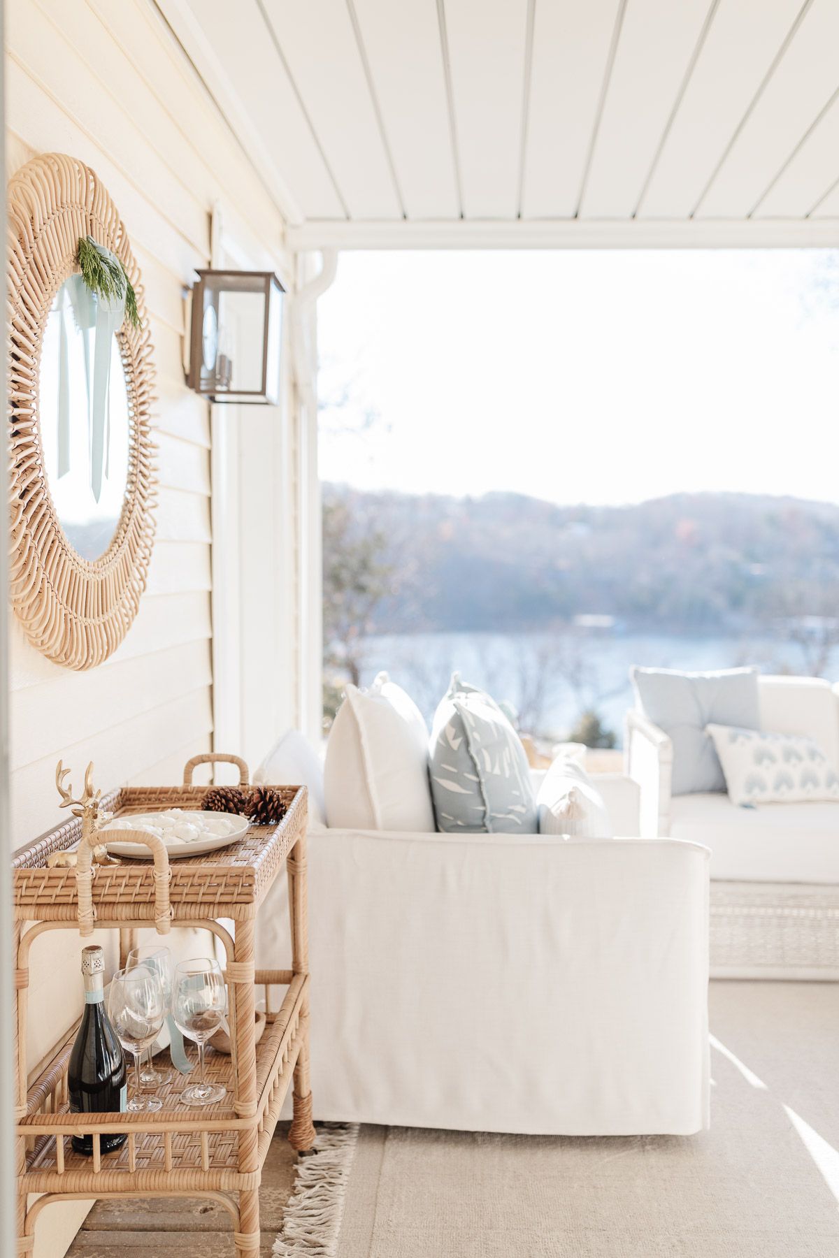 White serena and lily outdoor furniture on a lakefront patio