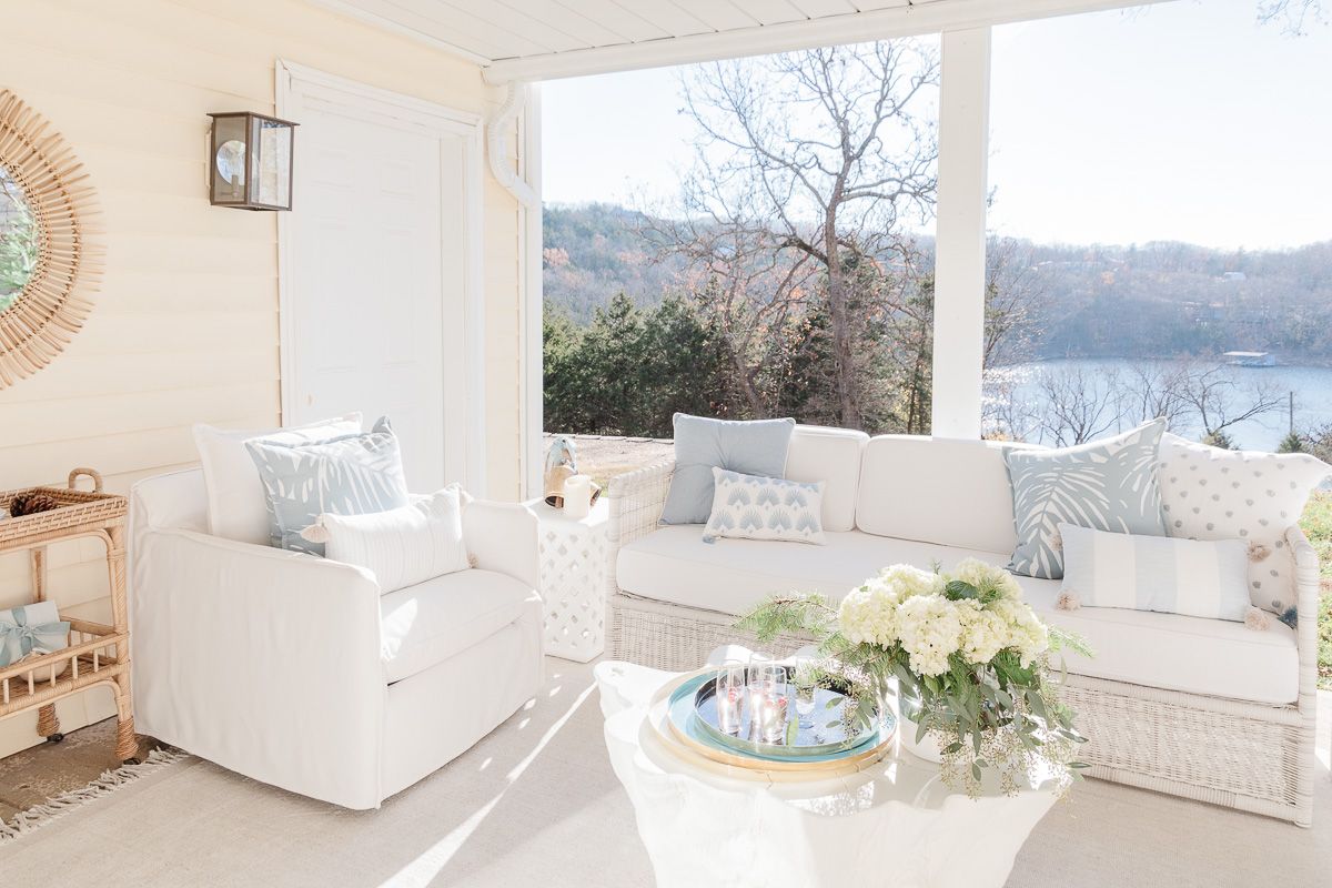 White serena and lily outdoor furniture on a lakefront patio