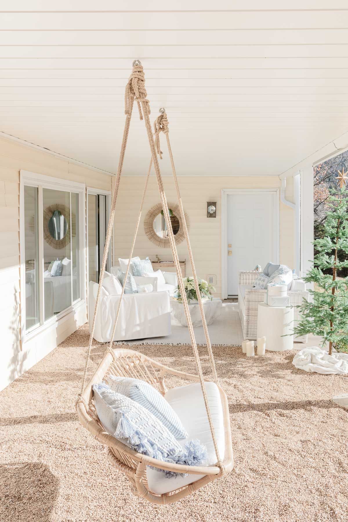 White serena and lily outdoor furniture on a lakefront patio