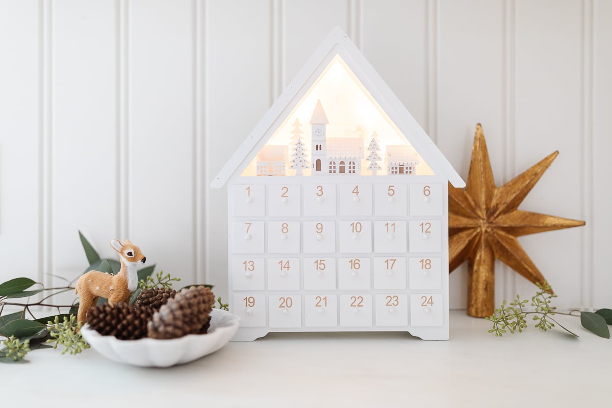 advent calendar surrounded by christmas decor