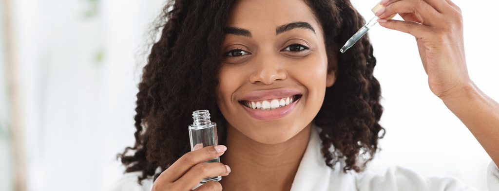 Woman applying serum