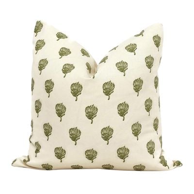 A green and white pillow cover from Amazon home.