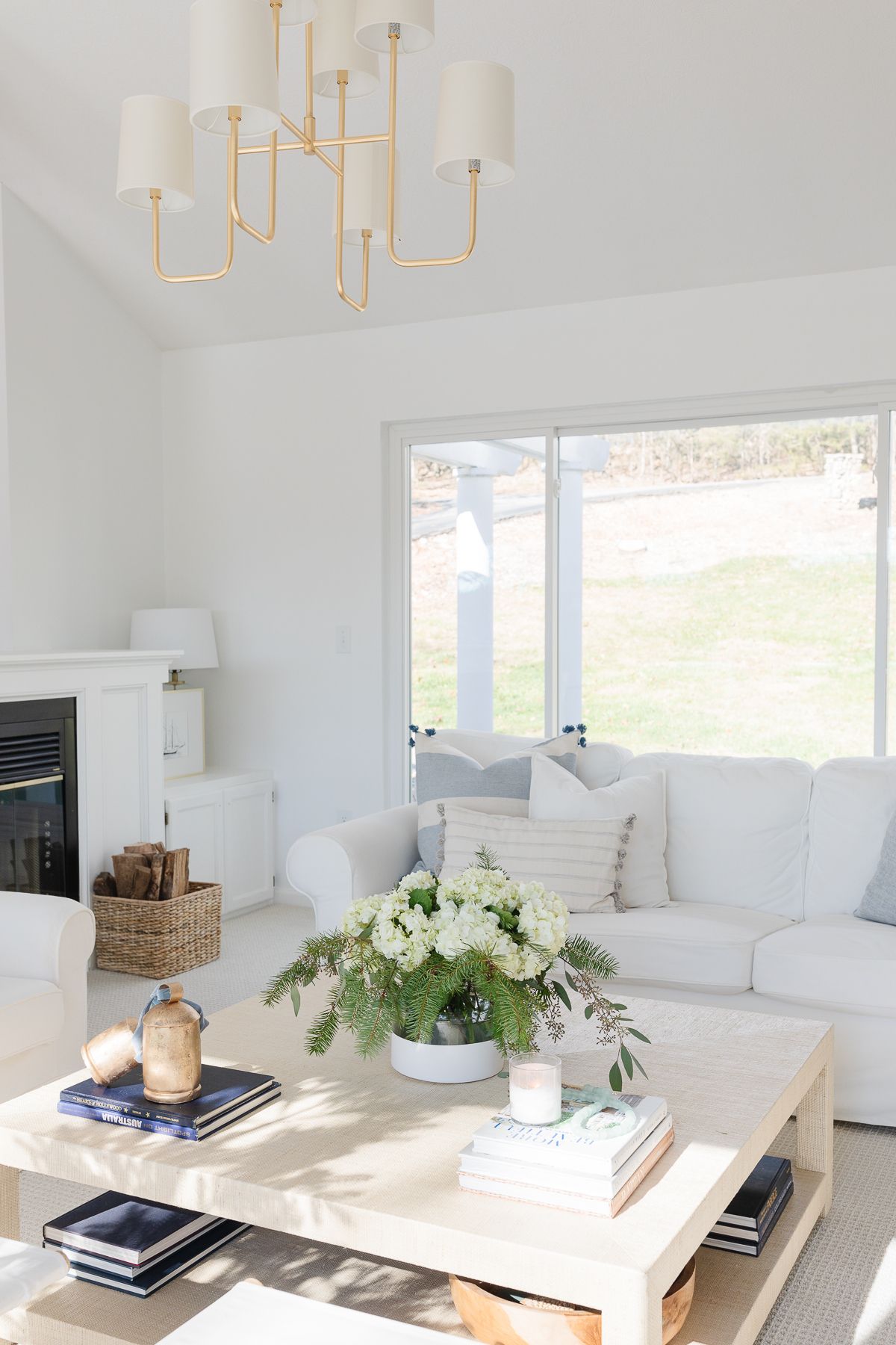 A living room with white furniture painted in Benjamin Moore Chantilly Lace