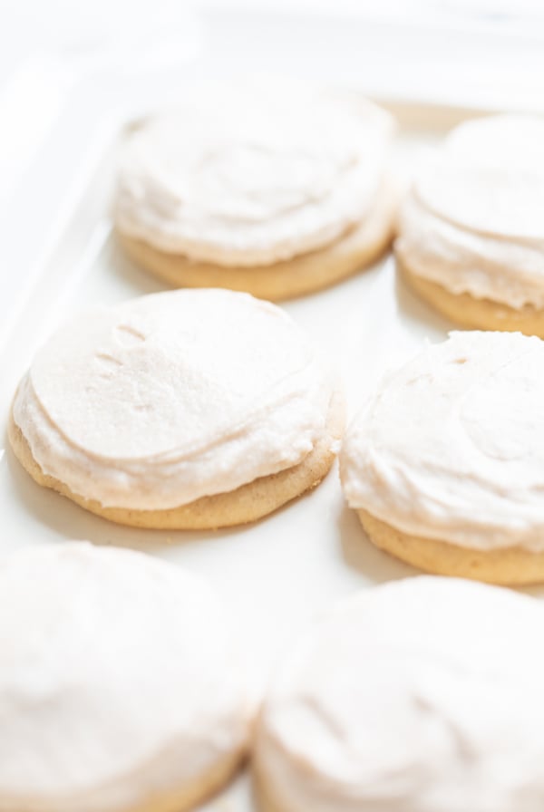 frosted cinnamon sugar cookies on a white platter