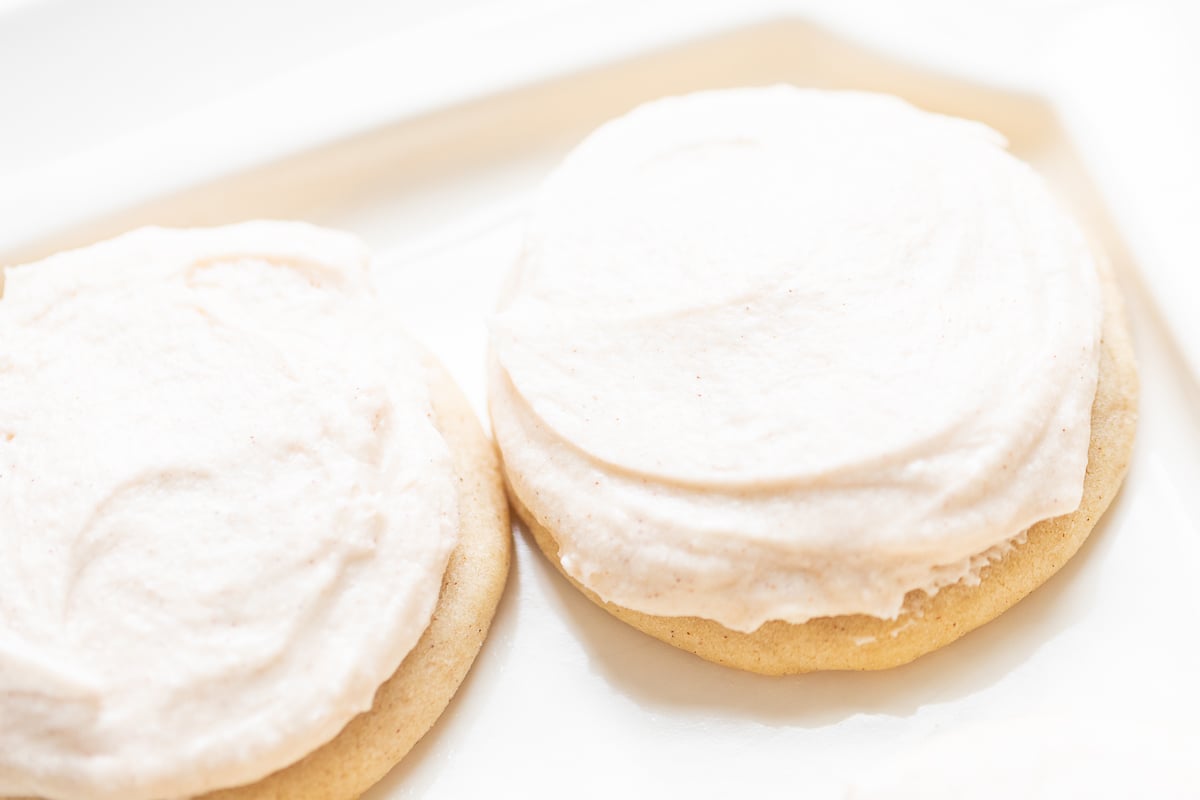 frosted cinnamon sugar cookies on a white platter