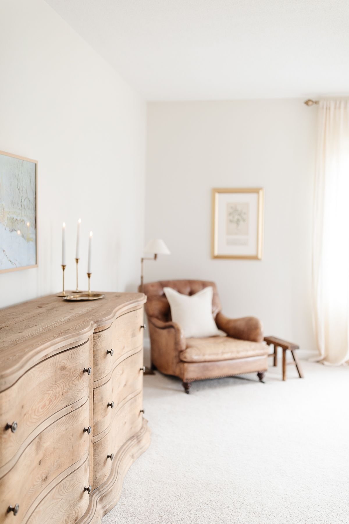 A bedroom with traditional christmas decorating ideas, candles on a dresser