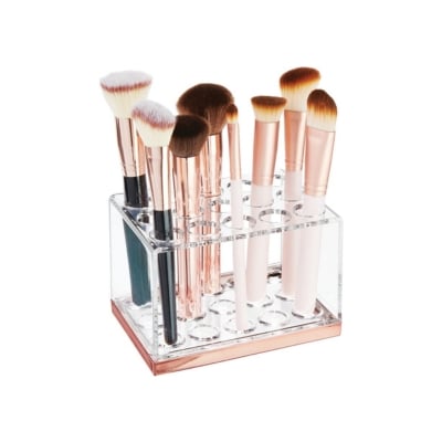 A makeup brush holder for bathroom organization.