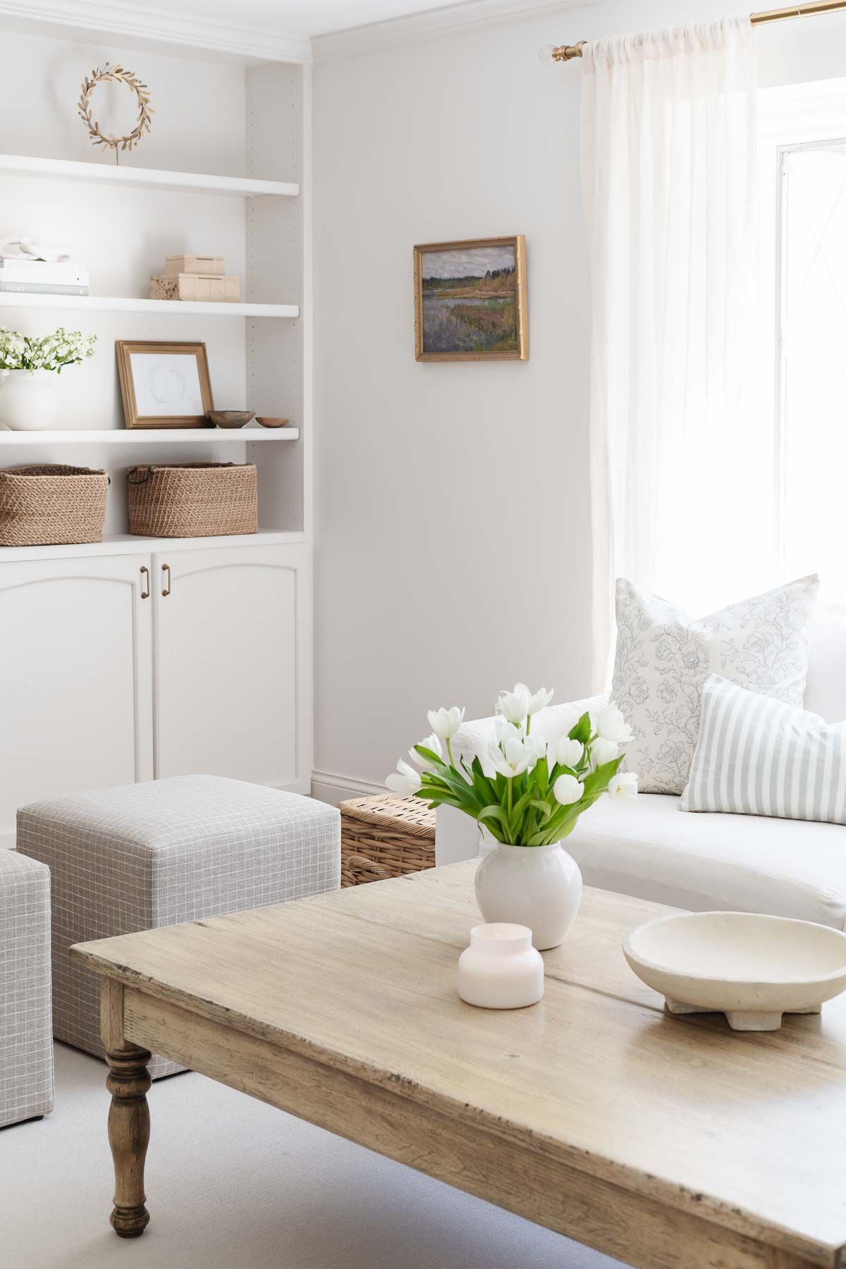 White sofa in a white living room with a wood coffee table