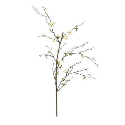 A faux flower greenery branch on a white background.