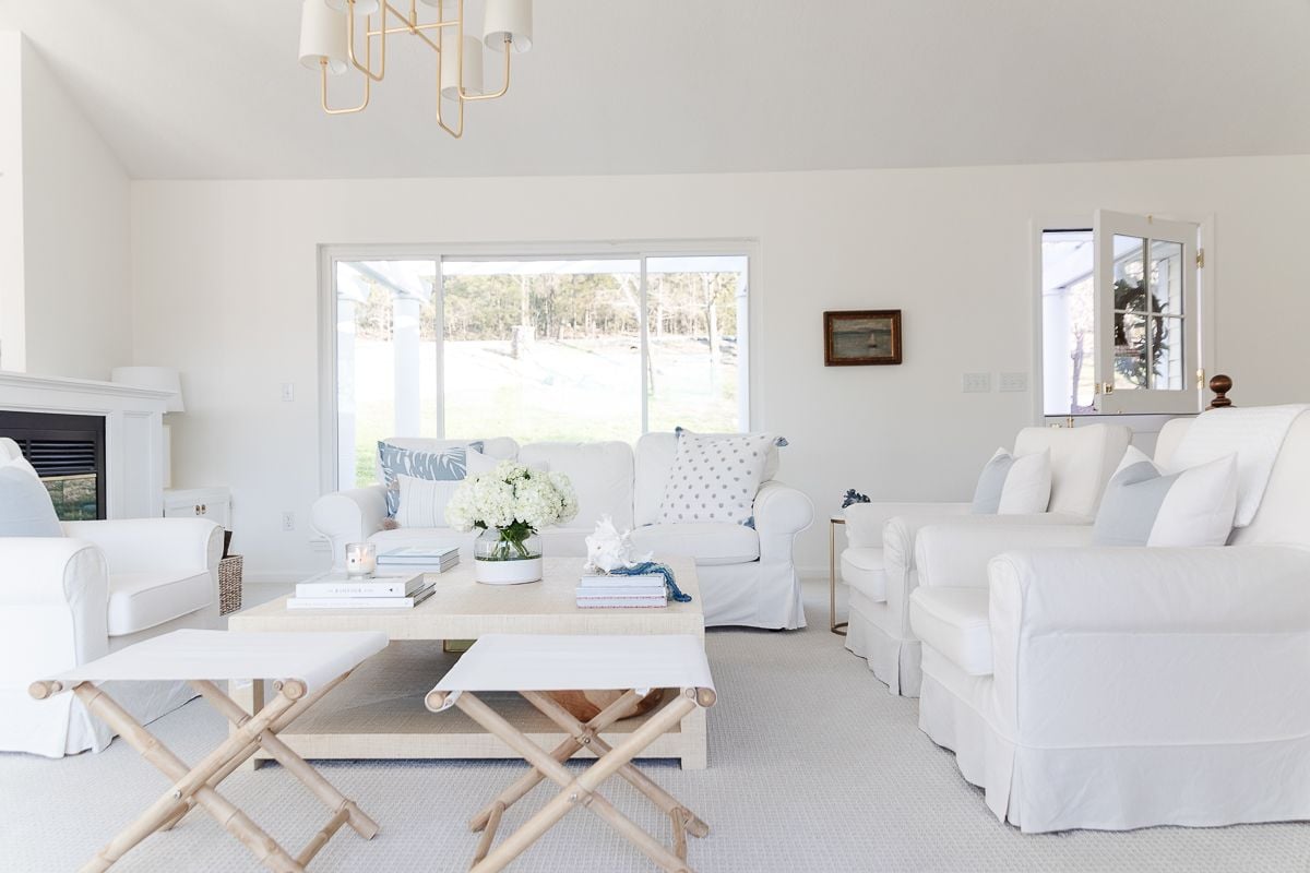 A white living room with the perfect cream living room paint color on the walls