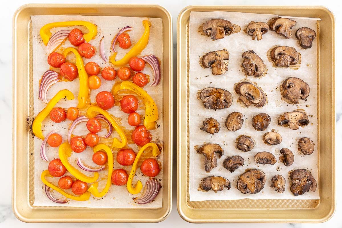 Two gold sheet pans full of roasted veggies