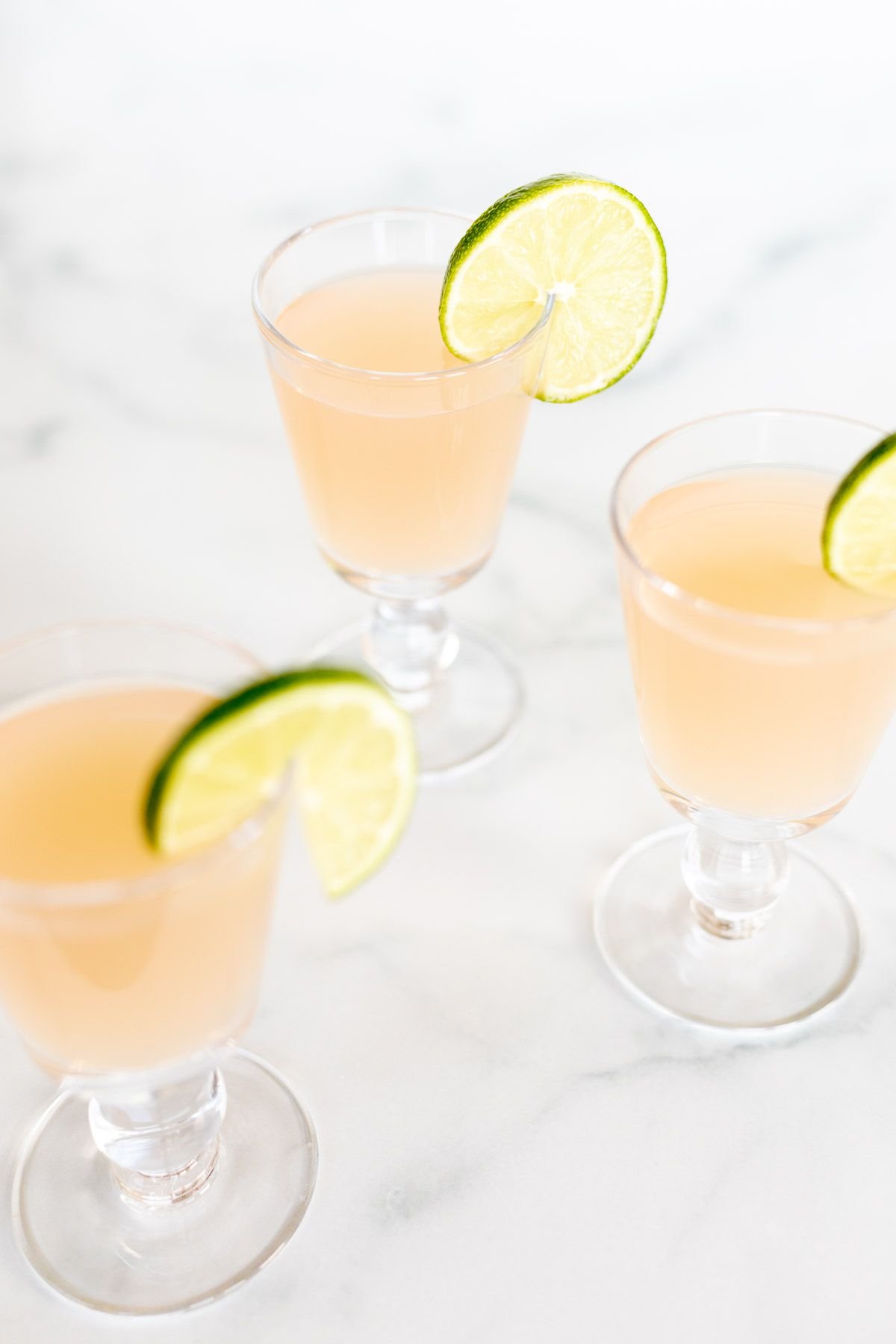 Three glasses of wine margaritas on a marble surface