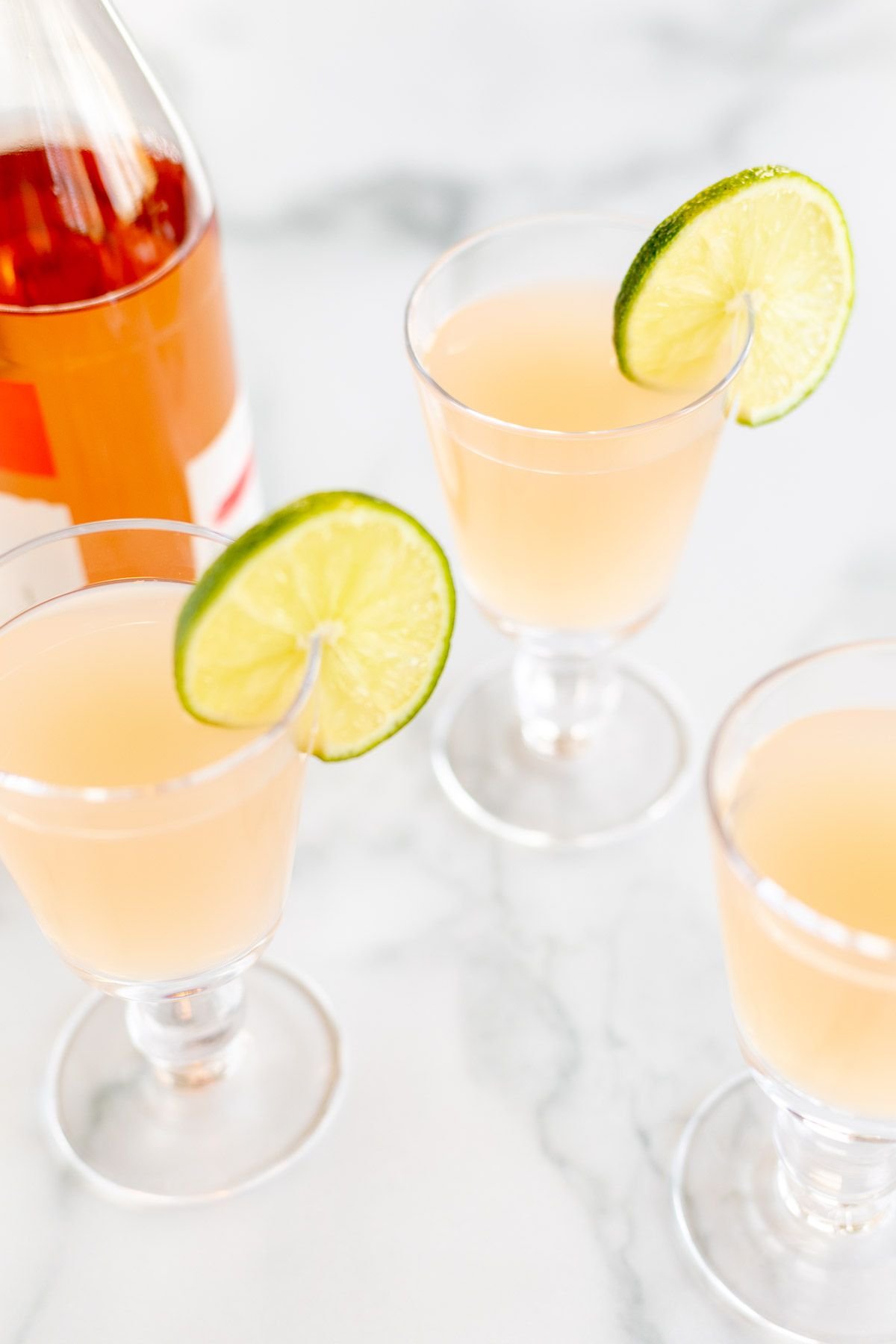 Three glasses of wine margaritas on a marble surface