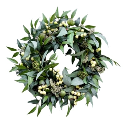 A eucalyptus wreath with berries perfect for front door decor all year round.