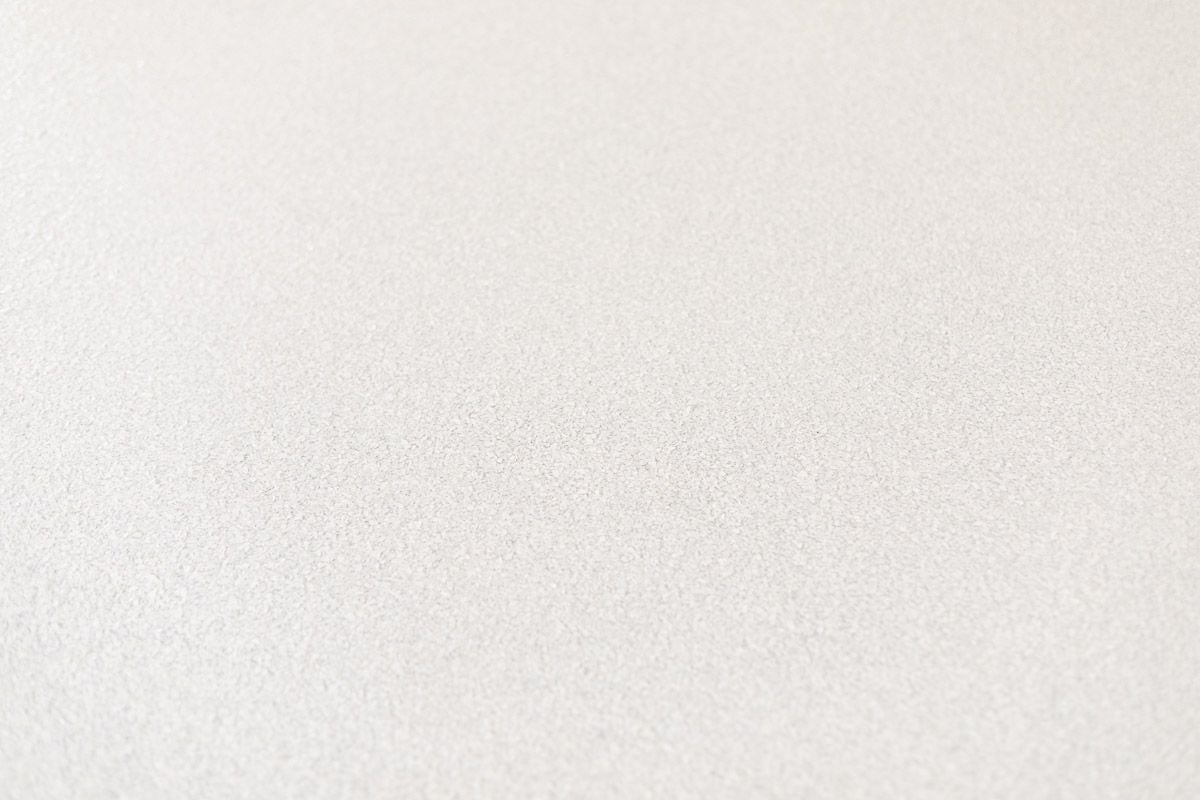 A close up of a greige garage floor coating made of polyaspartic.