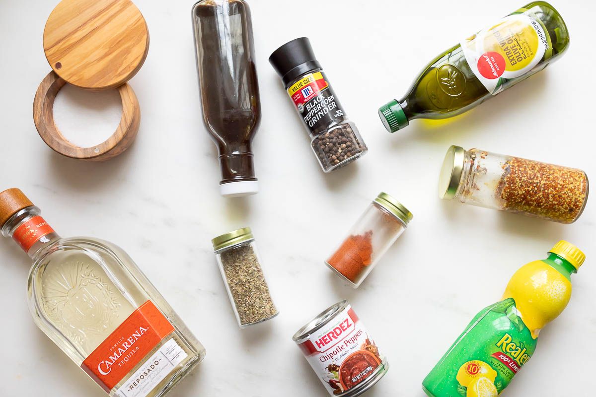 Ingredients for a carne asada marinade on a white surface