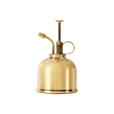 A brass misting bottle