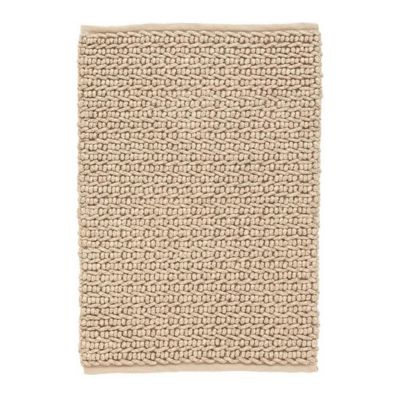 A beige textured indoor outdoor rug on a white background.