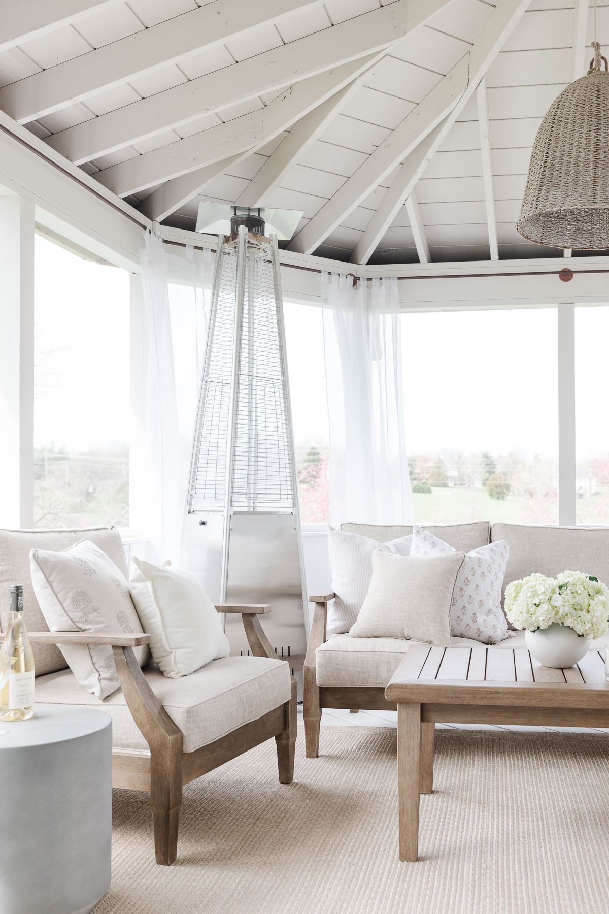 A white painted home porch completed with screened porch kits