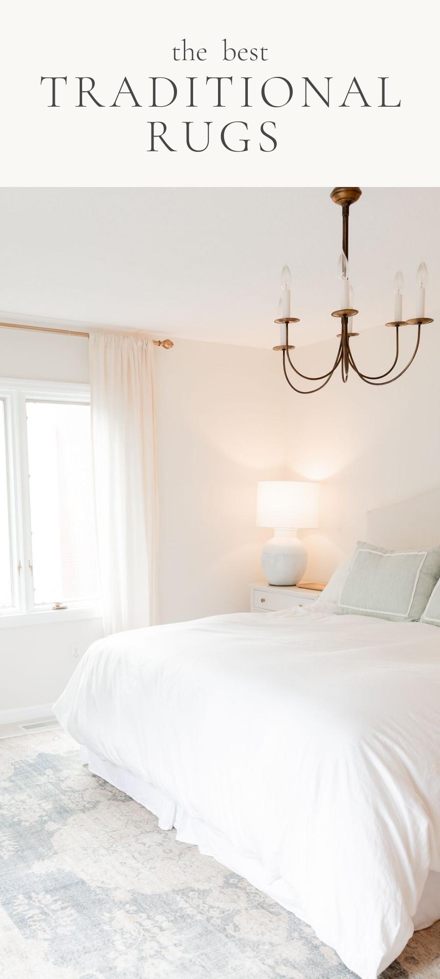 bedroom with rug bed pillows widows curtains lamp and chandelier