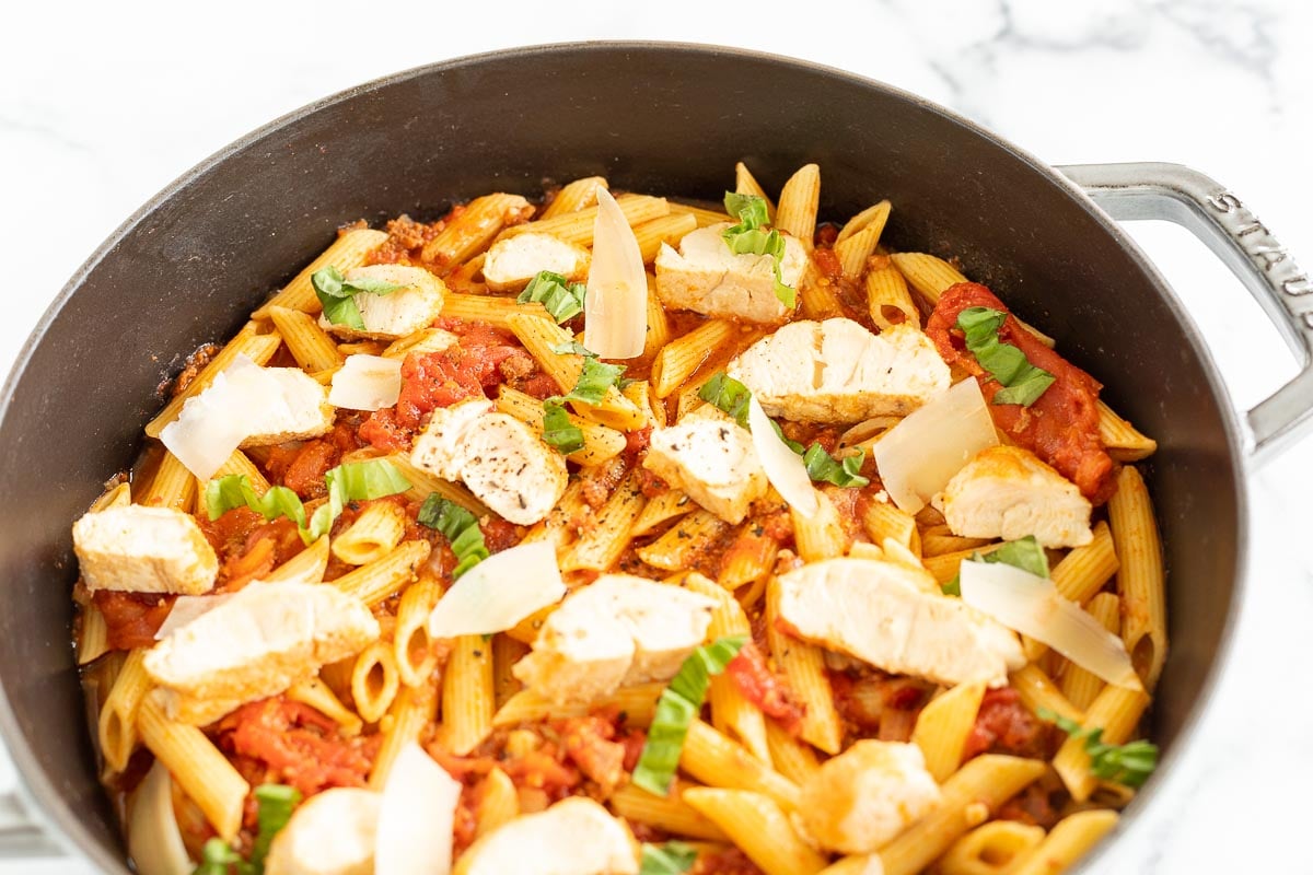 A saute pan filled with a chicken pasta recipe