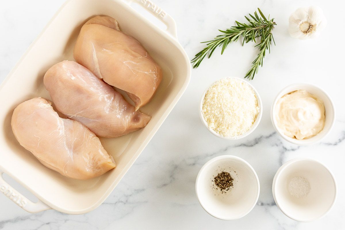 Ingredients for mayo chicken laid out on a marble surface.
