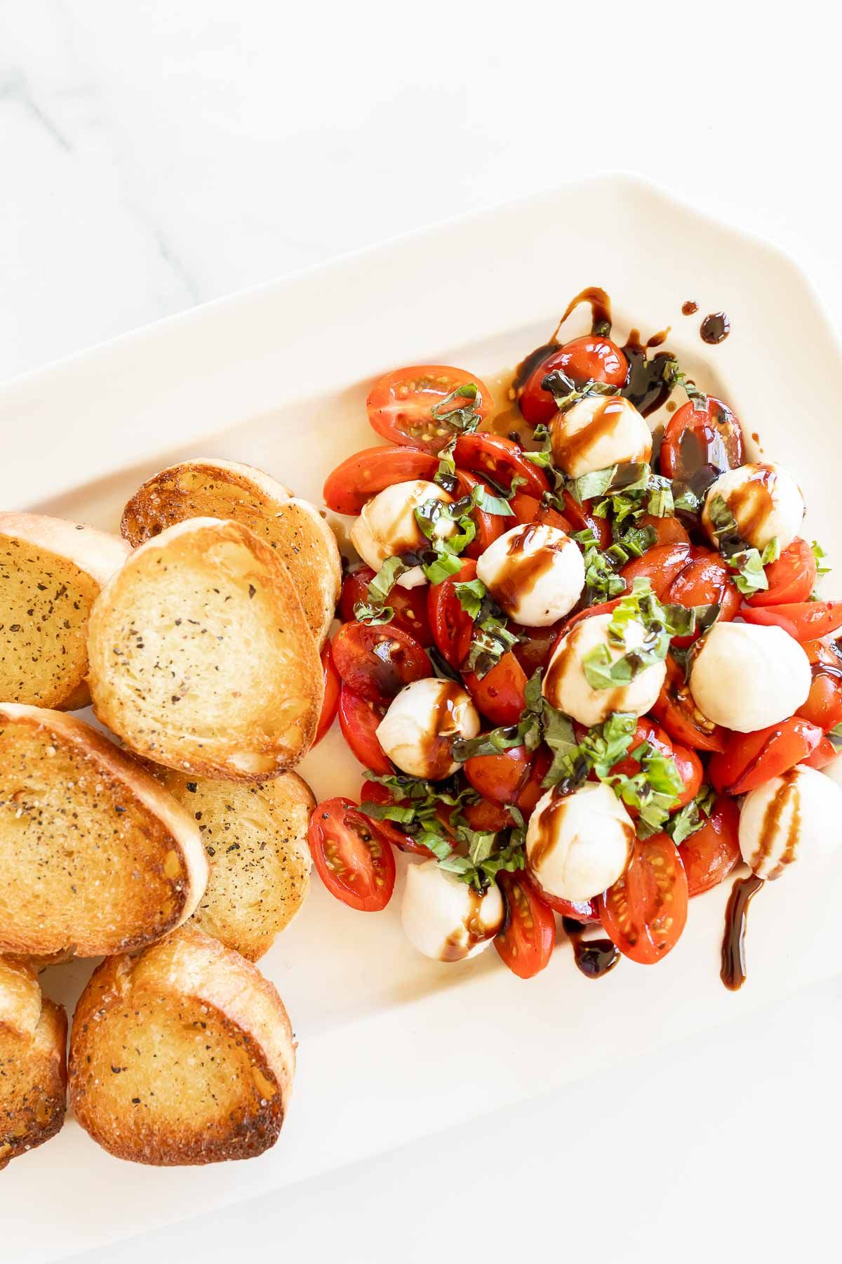 Bruschetta Mozzarella on a white platter