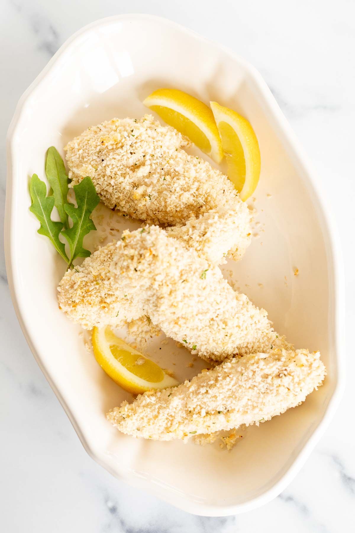 baked panko chicken on a white platter