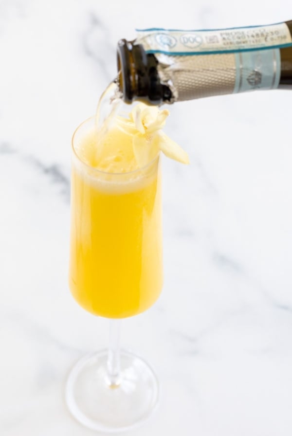 The best prosecco for mimosas pouring into a champagne glass