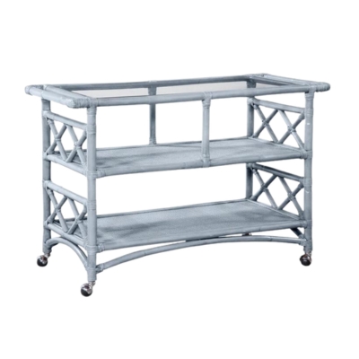 a blue rattan bar cart