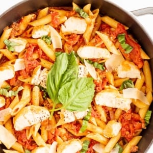 Chorizo and chicken pasta in a cast iron skillet.