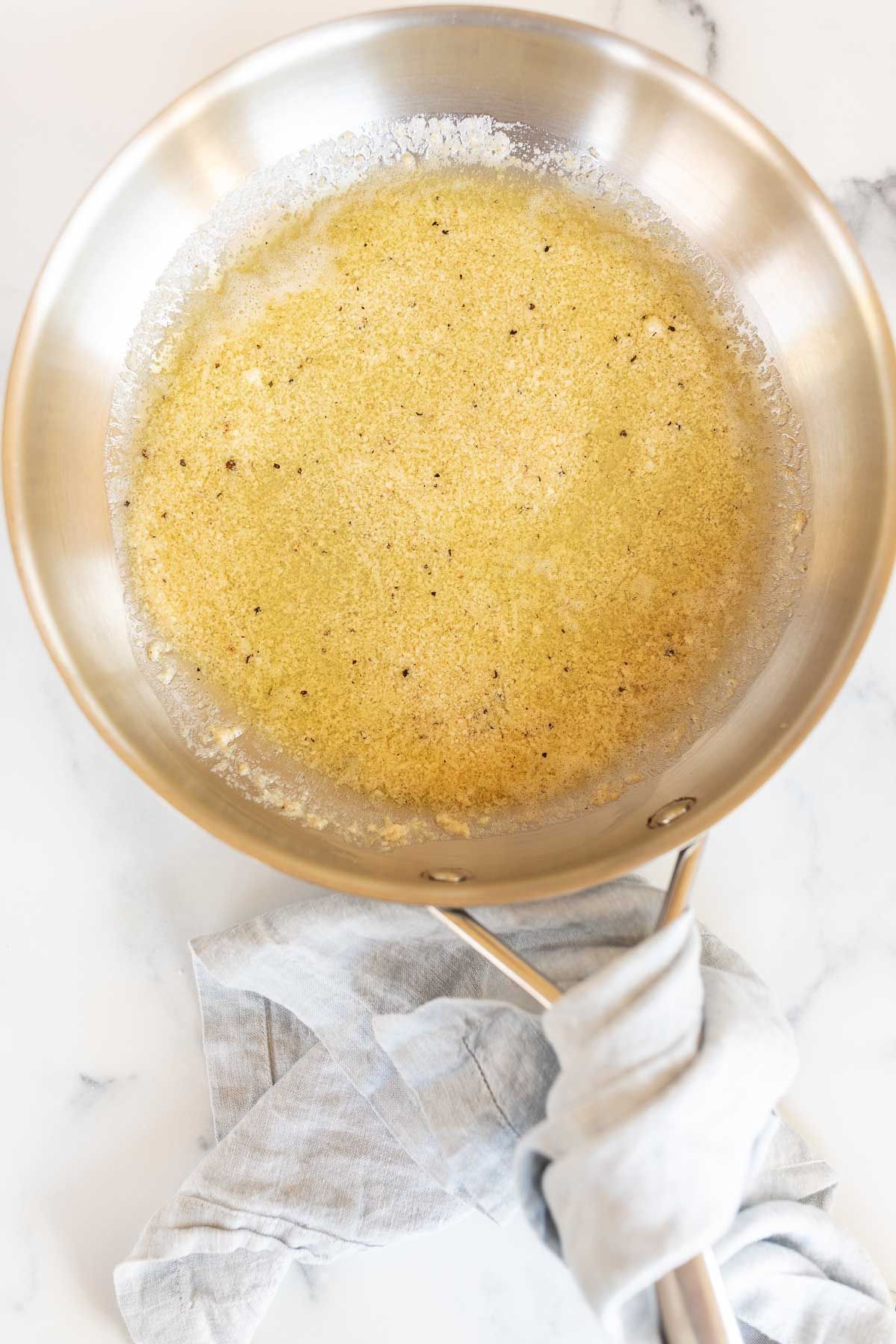 garlic parmesan pasta sauce in a silver pan