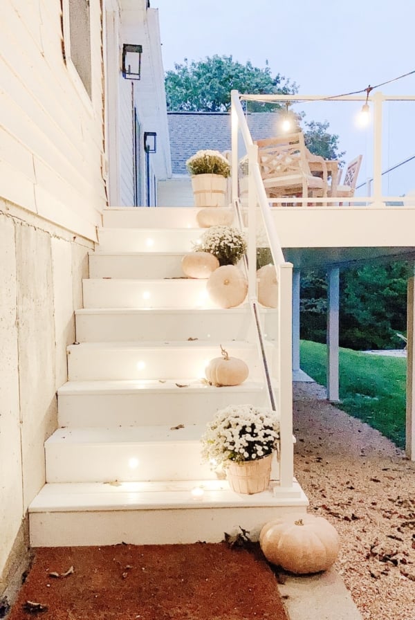 Deck lighting on white vinyl deck steps