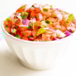 A white bowl of pico de gallo