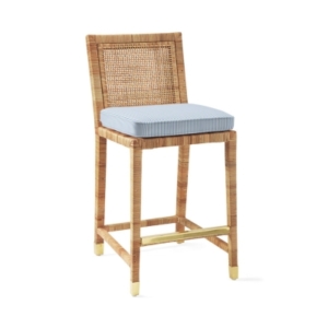 Rattan bar stool with blue cushion.